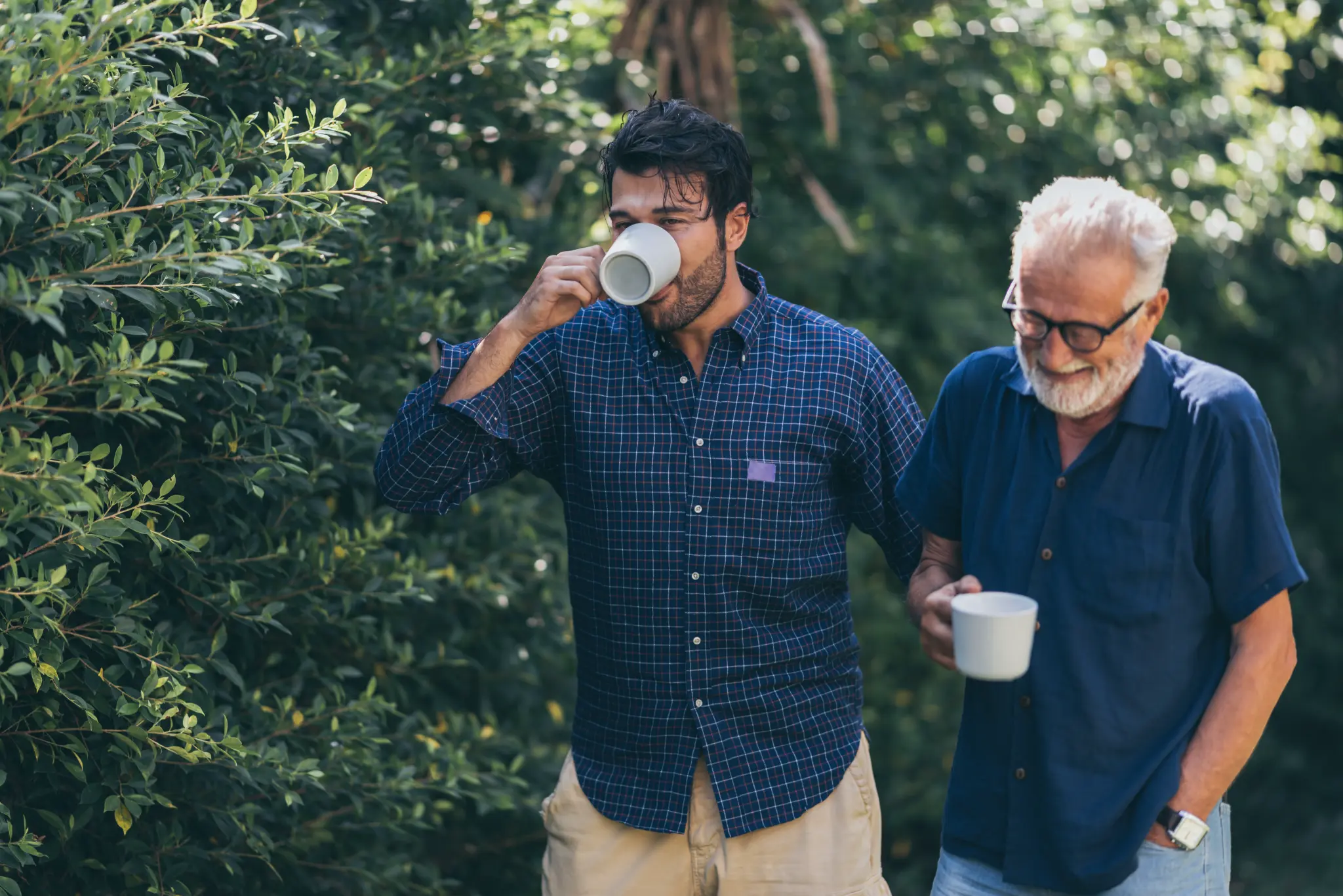 Two men enjoying tea in the garden