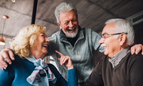 Older friends laughing together